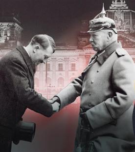 Historisches Foto: Adolf Hitler wird von Reichspräsident Paul von Hindenburg per Handschlag zum Reichskanzler ernannt. Rechts der Moderator Mirko, der fragend einen Finger ans Kinn gelegt hat.