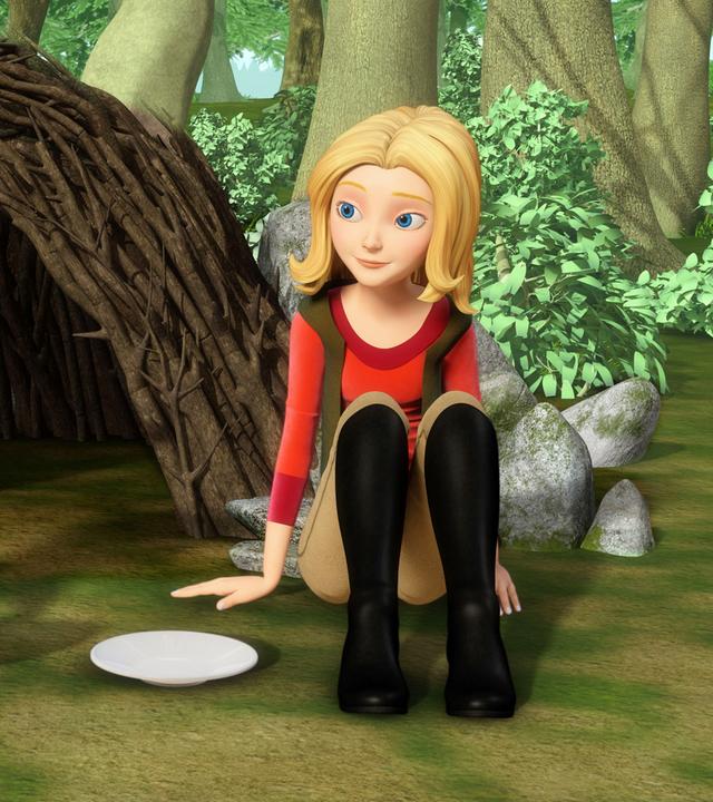 Wendy und Bianca sitzen auf dem Waldboden vor einer "Hütte" aus Ästen.