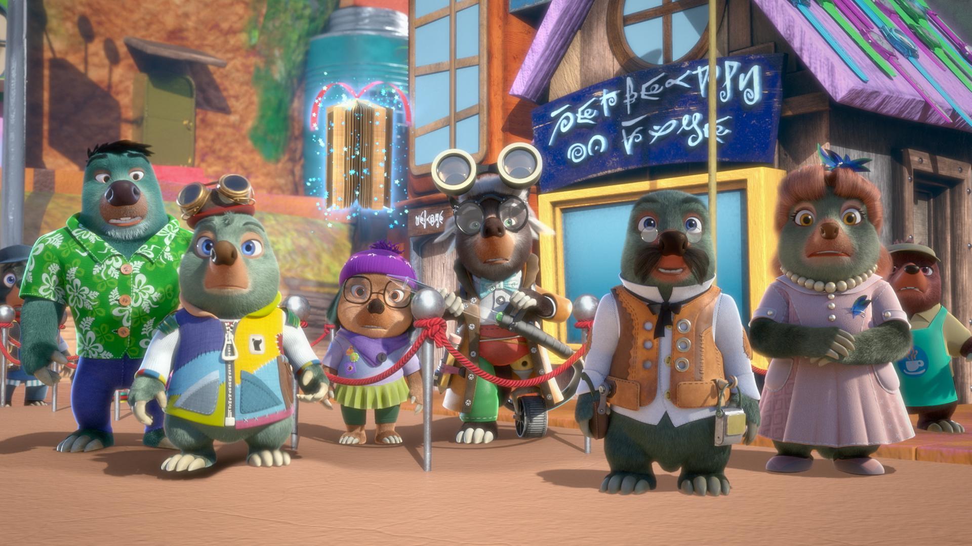 Moley, Dotty und Onkel Mischmasch stehen gemeinsam mit den anderen auf dem Marktplatz und schauen etwas verwirrt und fragend in die gleiche Richtung.