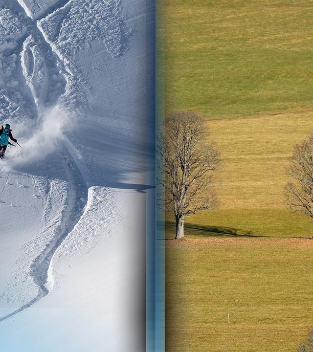 Landschaft mit Schnee und Skifahrer neben Landschaft ohne Schnee.
