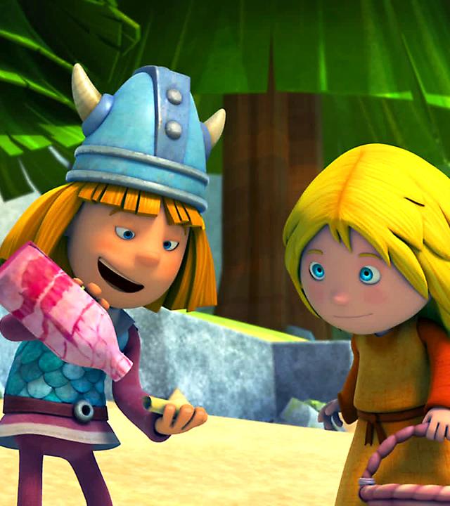 Wickie schüttelt den Brief aus der Flaschenpost. Ilvy steht rechts neben ihm und sieht ihm zu.