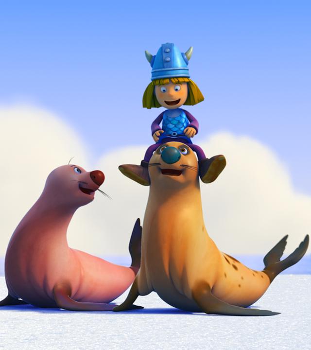 Wickie sitzt auf einer Robbe. 