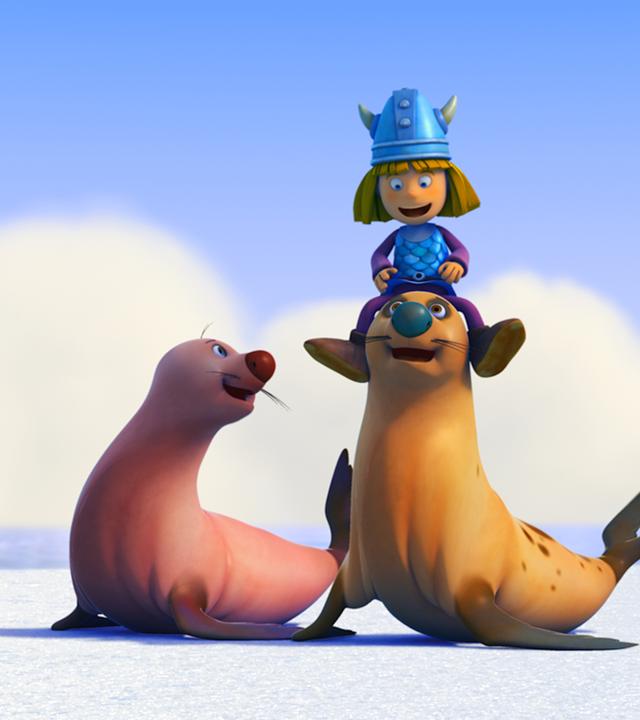 Wickie sitzt auf einer Robbe. 