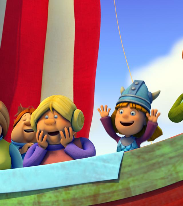 Die Frauen und Wickie stehen auf dem Drachenboot an der Reling.