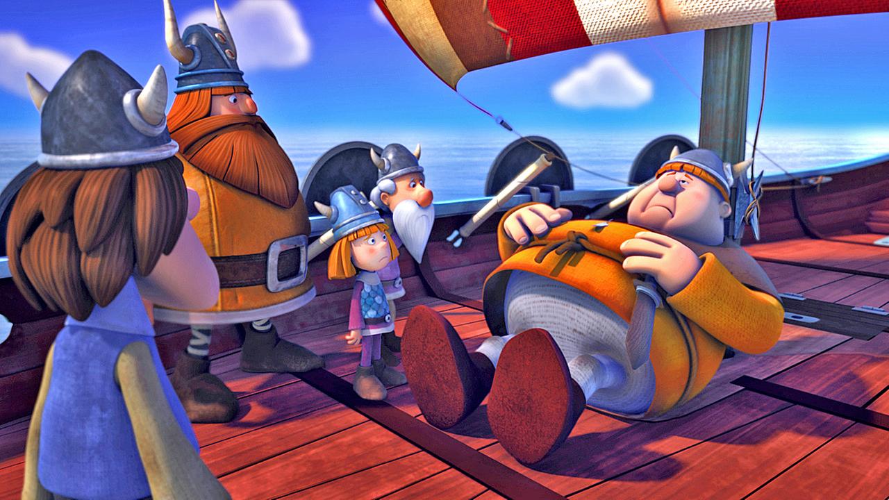 Faxe liegt mit Bauchschmerzen an Deck des Schiffes und hält sich den Bauch. Um ihn herum stehen Urobe, Halvar, Wickie und Tjure.