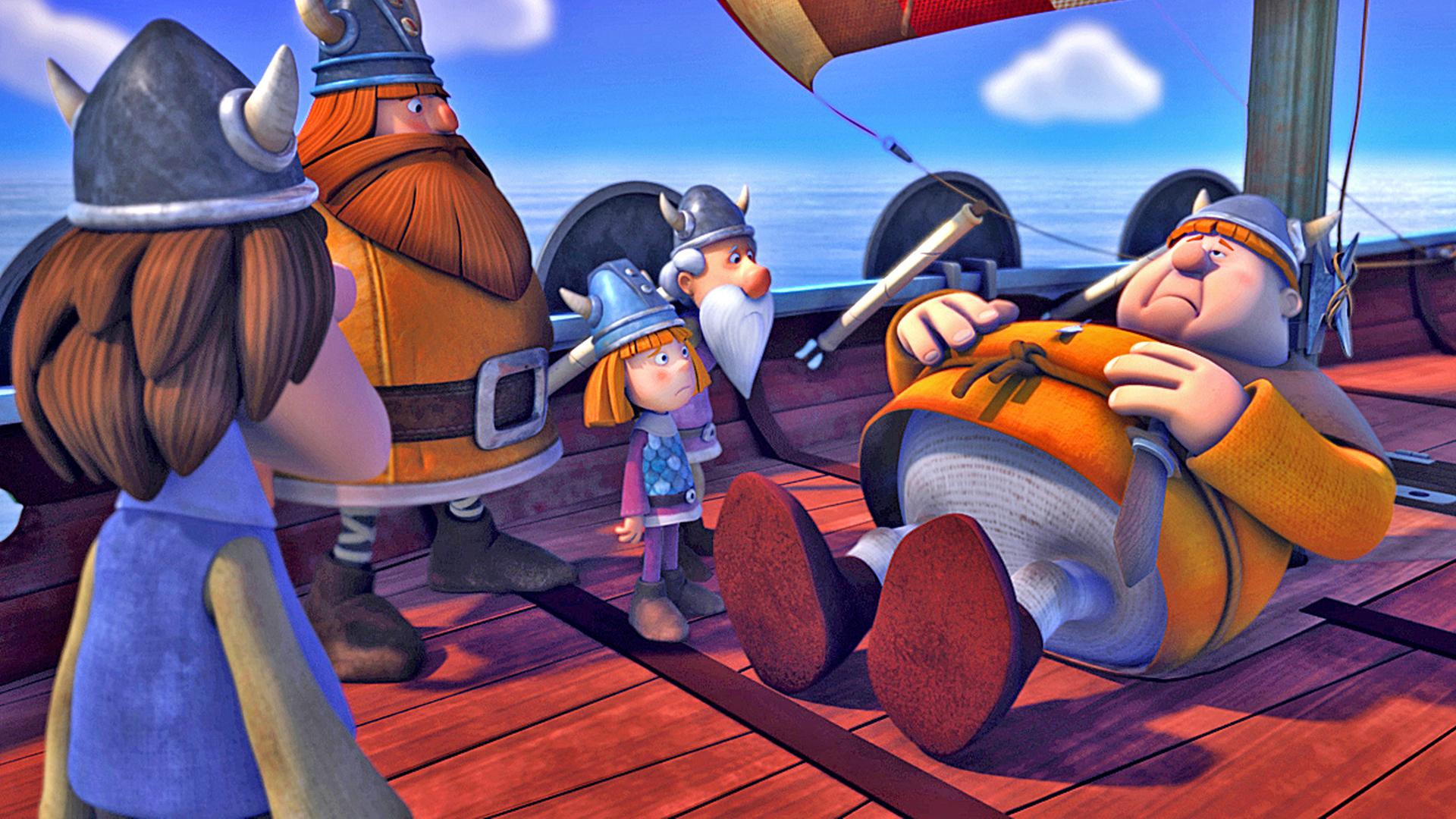 Faxe liegt mit Bauchschmerzen an Deck des Schiffes und hält sich den Bauch. Um ihn herum stehen Urobe, Halvar, Wickie und Tjure.