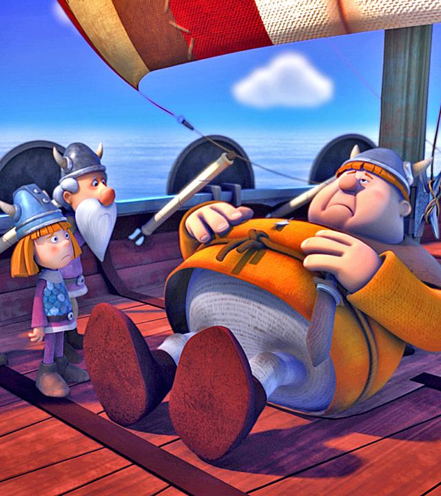 Faxe liegt mit Bauchschmerzen an Deck des Schiffes und hält sich den Bauch. Um ihn herum stehen Urobe, Halvar, Wickie und Tjure.