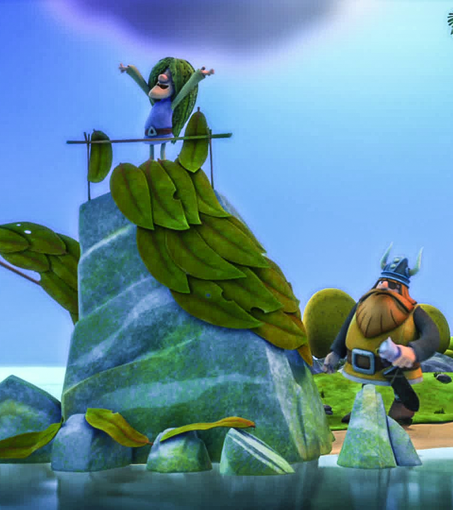 Tjure steht als Meerjungfrau verkleidet auf einem Felsen. Halvar versteckt sich dahinter. 