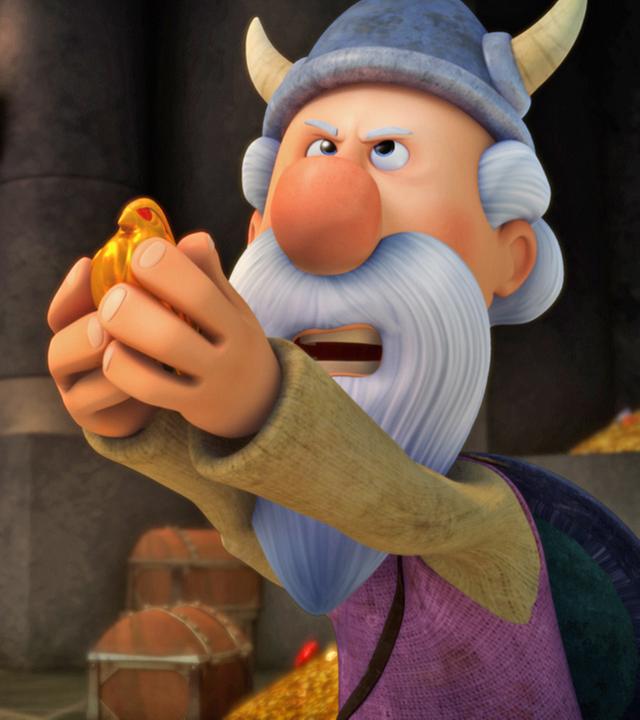 Urobe steht in der Schatzkammer und hält den goldenen Vogel in seinen Händen.