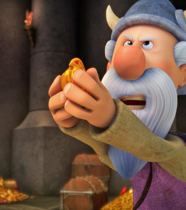 Urobe steht in der Schatzkammer und hält den goldenen Vogel in seinen Händen.