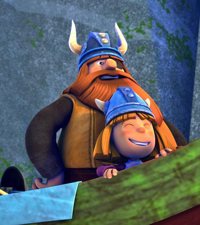 Die Wikinger stehen lachend auf dem Boot. Rechts stehen Wickie und Halvar, links hinter ihnen die übrigen Wikinger.