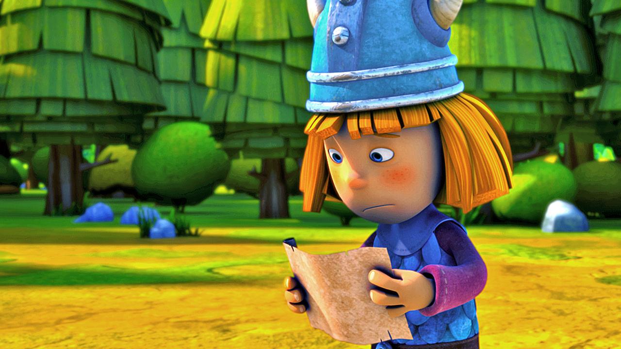 Wickie hält eine Schriftrolle in beiden Händen und liest darauf eine Aufgabe für seine Prüfung zum "wahren Wikinger". Er sieht besorgt aus.