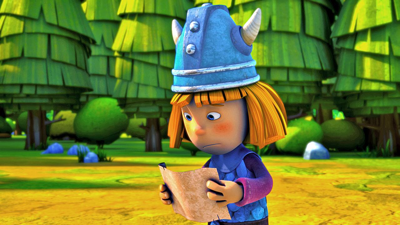 Wickie hält eine Schriftrolle in beiden Händen und liest darauf eine Aufgabe für seine Prüfung zum "wahren Wikinger". Er sieht besorgt aus.