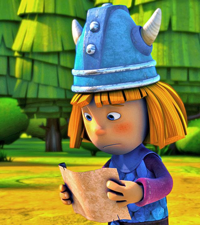 Wickie hält eine Schriftrolle in beiden Händen und liest darauf eine Aufgabe für seine Prüfung zum "wahren Wikinger". Er sieht besorgt aus.