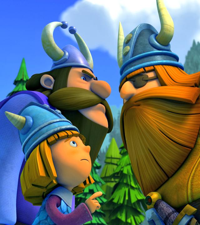 Halvar (rechts) und Baltak (links) stehen beinahe Nase an Nase und sehen sich böse an. Zwischen ihnen steht Wickie.