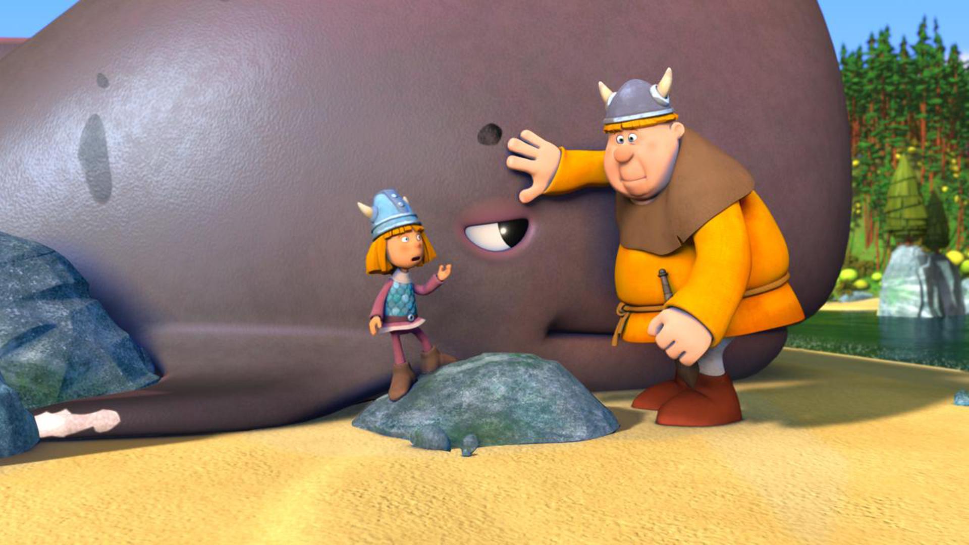 Wickie und ein anderer Faxe versuchen den Wal zurück ins Wasser zu schieben.