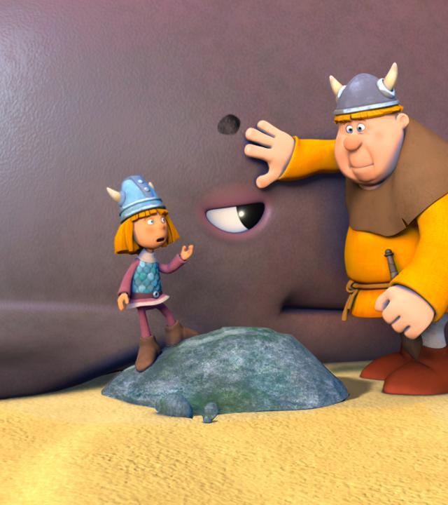Wickie und ein anderer Faxe versuchen den Wal zurück ins Wasser zu schieben.