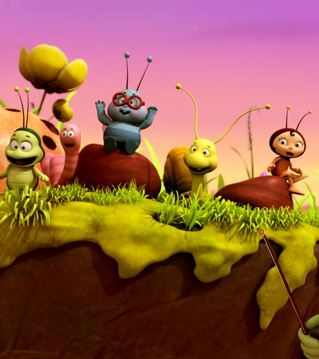 Die Wiesenbewohner sitzen auf einer Erhöhung und beobachten Maja bei ihrer Vorstellung. Alle sind entzückt.