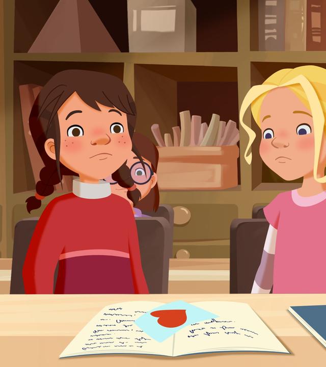 Als Tara einen Liebesbrief bekommt, ist sie ratlos. Tieneke sitzt neben ihr.