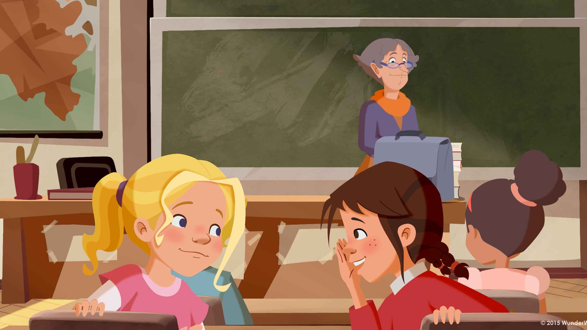 Tara und Tieneke planen schon im Unterricht ihre Aprilscherze und flüstern sich ihre Ideen zu. Die Lehrerin bemerkt es nicht.