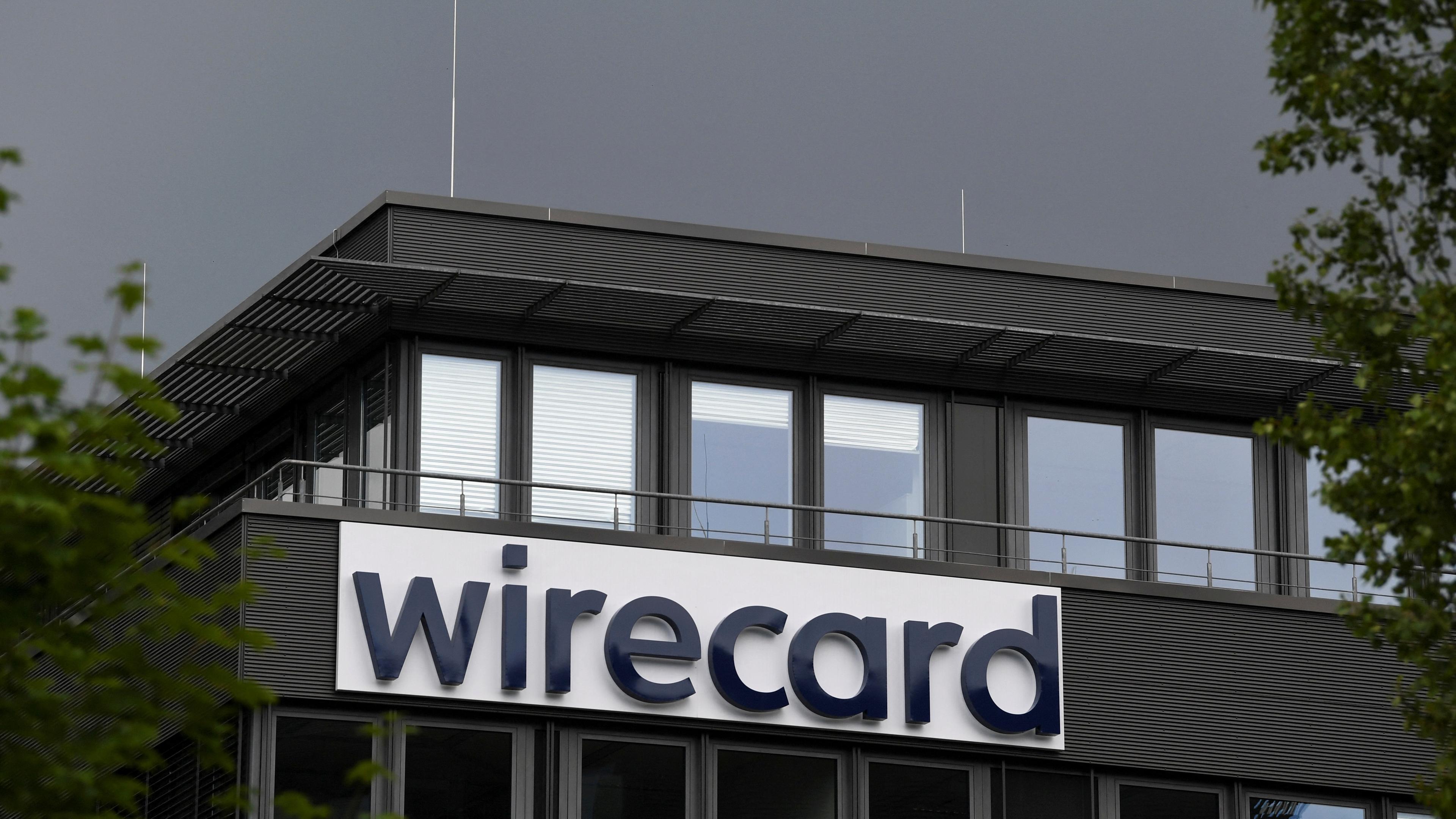 The logo of Wirecard AG, an independent provider of outsourcing and white label solutions for electronic payment transactions, is pictured at its headquarters in Aschheim, near Munich, Germany, July 1, 2020. 