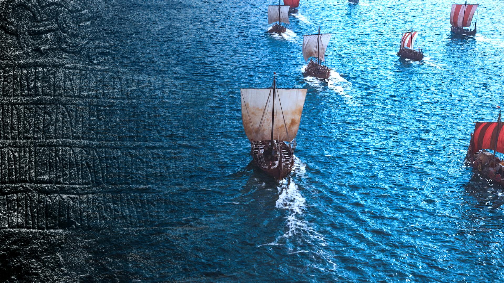 Mehrere historische Segelschiffe mit rot-weißen Segeln fahren auf offenem Wasser